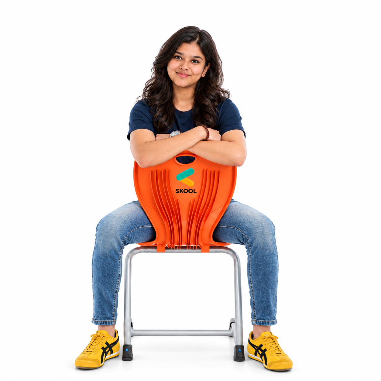 Student seated backwards on an orange SKOOL classroom chair